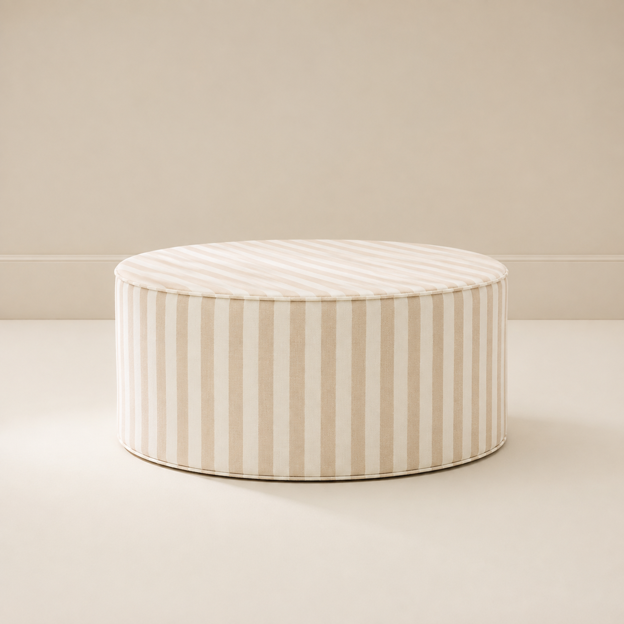 Totem Ottoman in Oatmeal stripe, a round striped ottoman that doubles as a footrest, seat or play surface
